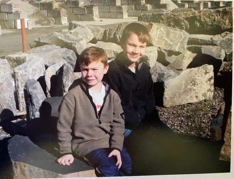 Dylan and Riley choosing memorial garden rock bench