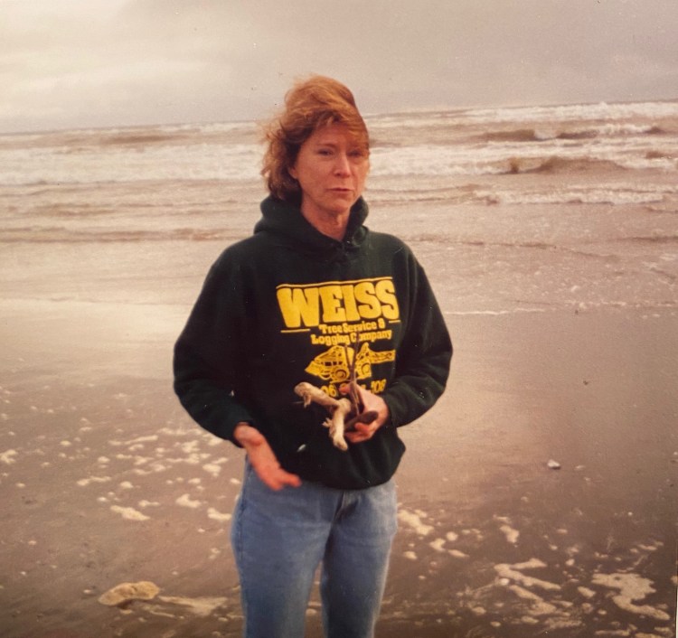 Kathy at the beach collecting treasures