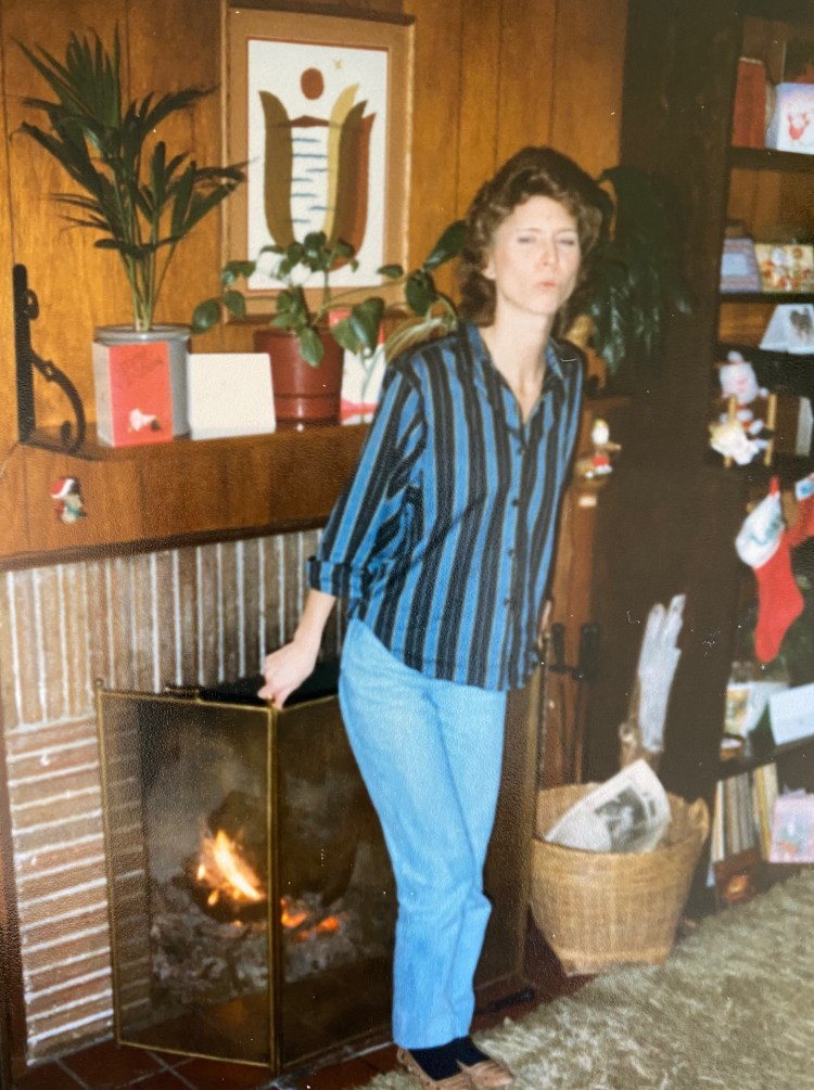 Kathy warming her tush by the fire