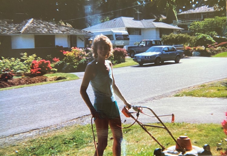 Kathy mowing the lawn